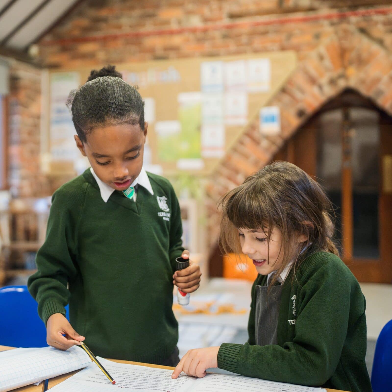 Boy and girl working together in a classroom